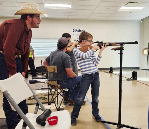 Larkin Loeffler coaches Walker Hines at the Texas BB Gun Championship. Courtesy photo.
