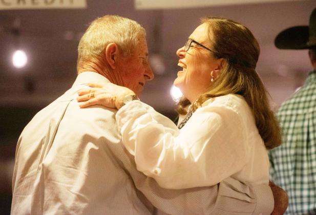 ABOVE- Menard’s Benny Fred Kothmann and wife Cordelia enjoy a dance and share a laugh during the live music on Friday night. Sandy Kothmann, photo.