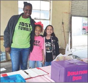 Tamara Hernandez, pictured left with two of her tumblers, Nayeli and Kelsey. Tamara, with family and friends, held a fish fry and bake sale on Good Friday. Funds will be put towards her new building location at the corner of Ellis and Mission St. in Menard.