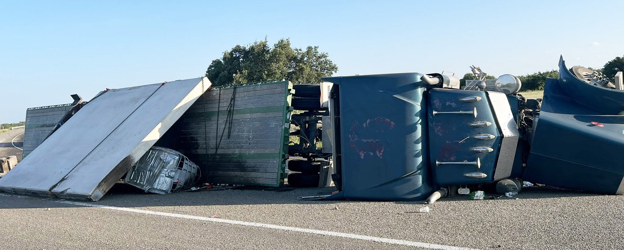 On the evening of July 29, 2026, a loaded flatbed tractor-trailer traveling northbound overturned at the merging of US 83S and SH 29E just south of Menard due to excessive speed. No injuries were reported. DPS called in hazmat teams to tend to the unknown liquid substance spilled from a tank on the trailer. It was later determined the substance was non-hazardous concrete sealant. Menard County Sheriff’s Office, MVFD, EMS and State Troopers responded. MCSO photo.