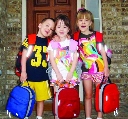 THEN... Truman, Ava and Cate Crawford on their very first day of school. Courtesy photo.