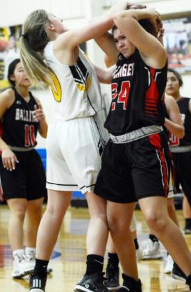 ABOVE - Lady Jacket Ayden Matlock gets tough during the non-district game against Ballinger JV.