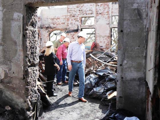 Congressman August Pfluger, front right, joined Mason County officials in touring the interior remains of the decimated Mason County Courthouse in February of 2021. Nicholas Miller, the subject accused of the arson was found guilty this week. Courtesy photo.