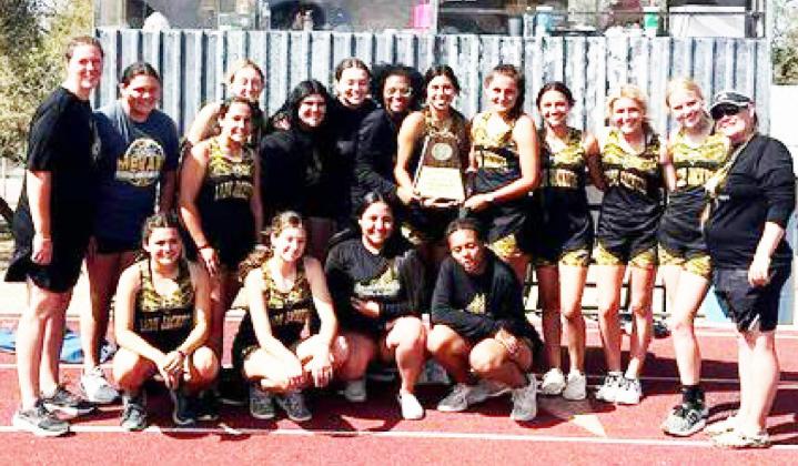 WE ARE THE CHAMPIONS- Lady Jackets tracksters claimed the District 12-1A championship by over 50 points. Pictured are, kneeling left to right: Jayla Arizola, Kendal Lawler, Audrey Mazac, Danielle Hartwick. Back: Coach Samantha Swarts, Kristen Portilla, Tatum Ruiz, Ayden Matlock, Kayleigh Zimmerman, Zoe Castleberry, Avieona Sanchez, Jalyn Montes, Makinley Kothmann, Hailey Ruiz, Korah Mayfield, Addy Bannowsky, Coach Nancy Saller