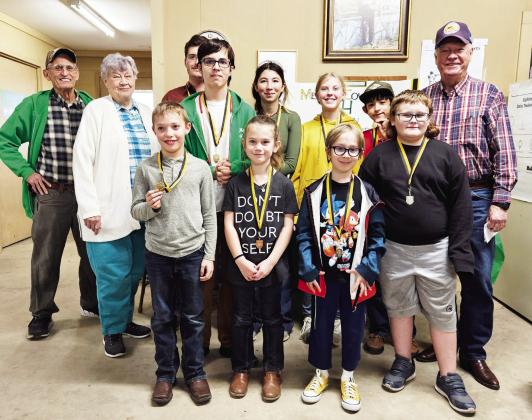 SHARP SHOOTERS at the Menard County BB Gun Match include (front row, left to right): Walker Hines, Kylie Smith, Turner Thigpen, Kobe King. Back row: Coach David Hand, Betty Jackson, Larkin Loeffler, Jackson Thigpen, Mia Estrada, Caitlyn Burch, Mason Mireles, Coach Terry Kelley. Courtesy photo.