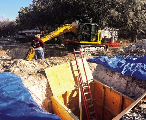 DIGGING FOR... (NOT GOLD)- Crews from the City of Menard have been addressing a sewer line leak near the intersection of Pine and Trinity on the city's north side. As of press time the obstruction had not been located and sewage contiues to flow. TMN photo.