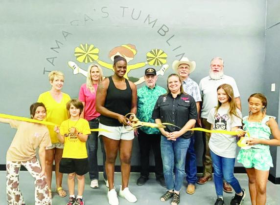 FLIPPN' OUT- Menard County Chamber of Commerce's newest member, Tamara's Tumbling &amp; Cheer, celebrated recently with a ribbon cutting. Pictured left to right, front- tumblers Lily Torres, George Corbin. Second row- Cherry Swindall, Chamber Executive Director; Jessica Elkins, parent of tumbler; Tamara Hernandez, owner/operator; Dean Mayhew, MIDC; Christy Eggleston, Chamber and MIDC; Lee Thornhill, Chamber; Randel Blesing, Chamber; tumblers Claire Corbin, Nayeli Hernandez. Courtesy photo.