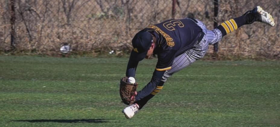 Yellowjacket Centerfi elder Joel Guerrero lays out for the dramatic catch during the Ranch Ball Tournament held in Menard on Saturday, March 19, 2022. Photo by Madolyn Nasworthy.
