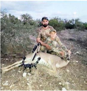 LEFT- Tony Bree, left, took stepson Eli Janke hunting this fall at Menard’s Luchenbach Ranch. They are pictured above with one of the cull bucks Eli took. Brent Crawford, photo.