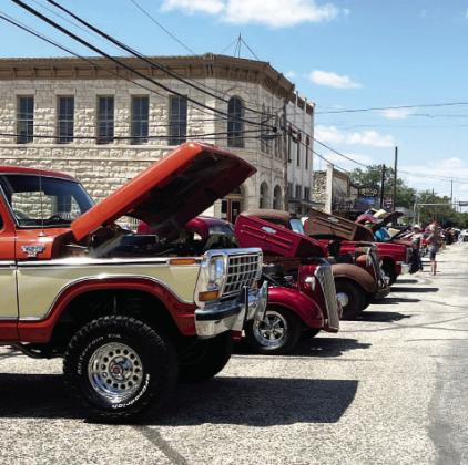 OF ALL TYPES were on display for the Sil-ver Spur's benefit car show on Saturday. Sixty-one vehicle entries pleased the crowds and raised $3k for Menard Youth Sports Association. TMN photo.