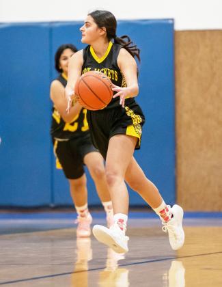 Lauren Guerrero works the ball down the court in Olfen.