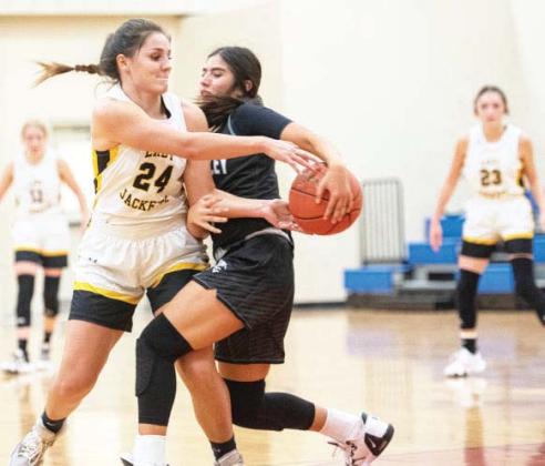 Lady Jacket Makinley Kothmann fi ghts for the ball against Water Valley on Tues