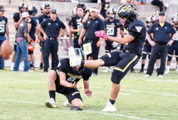 Senior Kade Rayburn kicks off for the inaugural game of the season. Madolyn Nasworthy photo.