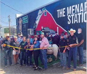 IT'S OFFICIAL- The Menard Station hosted guests at their grand opening and ribbon cutting on Saturday. The Davis family had live music, a rummage sale, and MVFD grilled up Waygu steak burgers, Dorper lamb burgers, and hot dogs. Meals were $10 per plate and all funds were donated to the Menard Benevolence Fund (MBF). Lowe's Market donated bottled water. MBF was established by the Davises to benefit MVFD, Menard 4-H, and the Boys & Girls Club. Saturday's efforts earned $1,831 for the fund. The Station is open