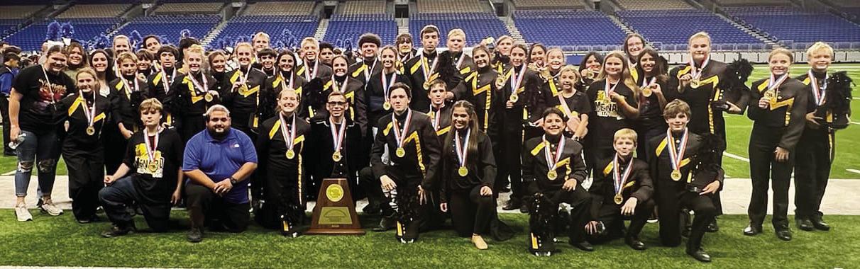 BELOW- The Menard Yellowjacket Band members with all their support staff and bus driver on the Alamodome fi eld after winning their second state championship. Courtesy photo