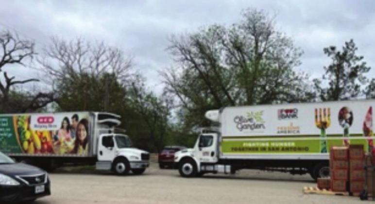 Semi loads of free food and water were distributed to families in Menard on Saturday.