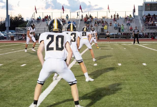 Menard's Bryce Davis (20), Hunter Squiers (13), Logan Powell (8) and Korbin Squiers (15) line up for an Aidan Ramon (65) kickoff during the the Jackets' 47-18 win over Bronte last week. Nora Davis, photo.