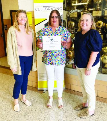 ABOVE- Menard HS counselor Felicia Laxson, center, accepts her Heart for Healthcare recognition from the Texas A&amp;M College of Medicine Rural Health Program. Laxson has been instrumental in inspiring local students to join the field of healthcare. Courtesy photo.