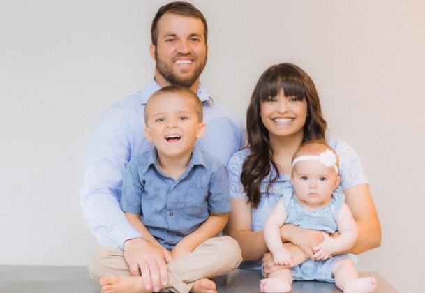 Menard County Farm Bureau agent Zach Nash with his wife Alyssa, and two children. Courtesy photo.