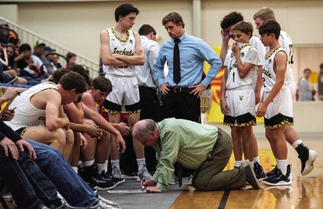 Coach Campbell is “ALL IN” when it comes to coaching his team, even if it involves getting down on the floor to draw plays during a re-grouping session.
