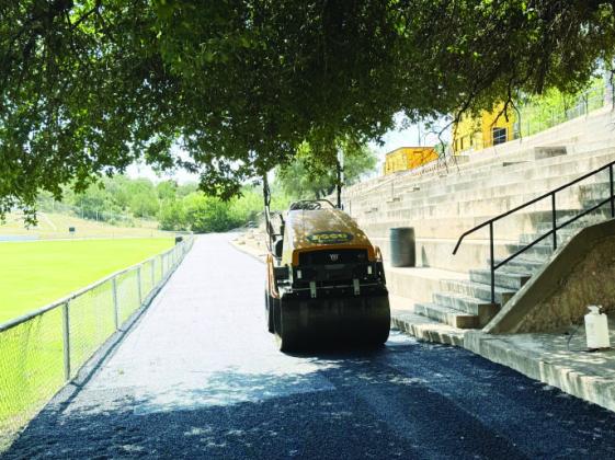 The ASCO Equipment roller was used to put the finishing touches on the new walking surface at Findlay Field. TMN, photo.