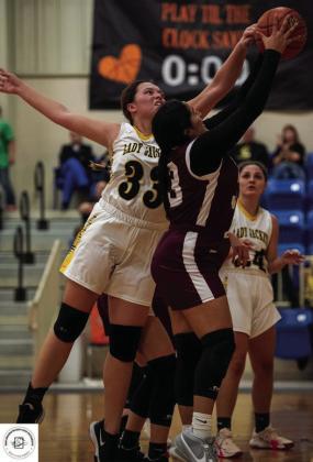 Senior Zoe Castleberry works for the rebound.