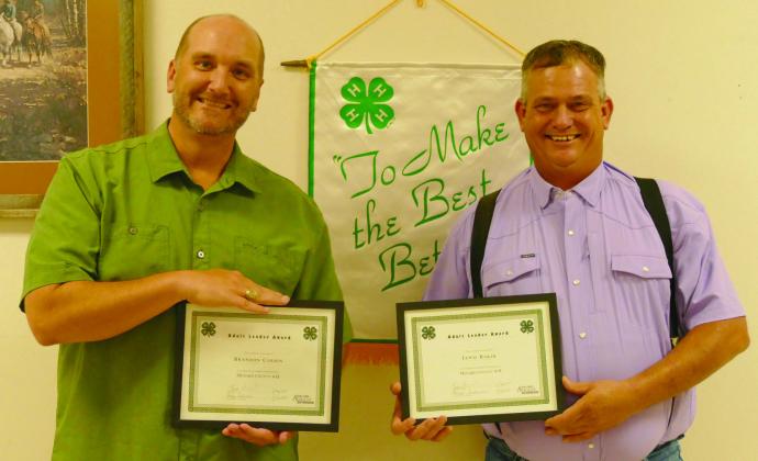 Menard County Judge Brandon Corbin (l) and Lewis “Cedarberry” Baker (r) accepted the Menard Co. 4-H Adult Leader Awards, chosen annually by the Youth Leadership Advisory Board to recognize adults who go above and beyond volunteering for 4-H. Courtesy Photo.