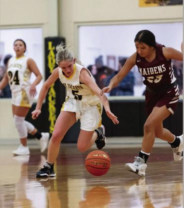 Menard freshman Taytum Chambless, center, out works and runs down a Paint Rock Maiden during the Lady Jackets' 94-5 scalping of Paint Rock last Friday. Teammate Perla Pecina is pictured in the background. Nora Davis, photo.
