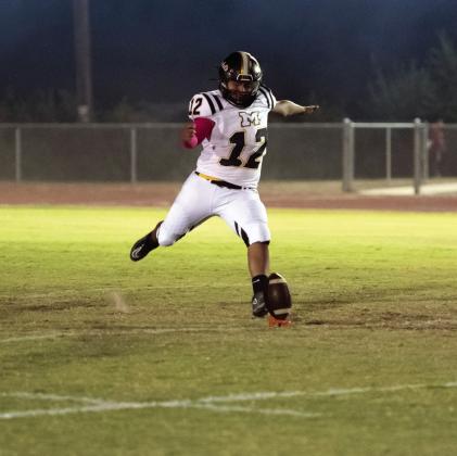CALLED UP- Freshman Yellowjacket Dario Gonzales stepped up big last Friday in his first ever varsity appearance. The consistent kicker is a part of the high-scoring, record-breaking JV squad of underclassmen. He has been called up to fill the kicking position on Friday nights, and had a respectable first showing, recording four of six on extra points kicks. Gonzales was also bestowed the 'Psycho' award, which goes to the special teams player of the week. Nora Davis, photo.