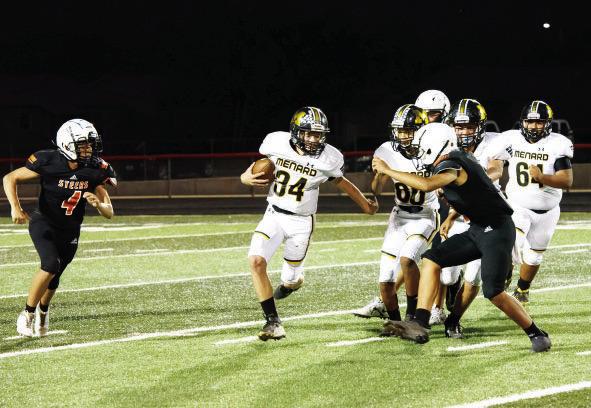 Menard freshman Tucker Pullen, center, works his way around a Robert Lee defender during the JV game last Thursday.