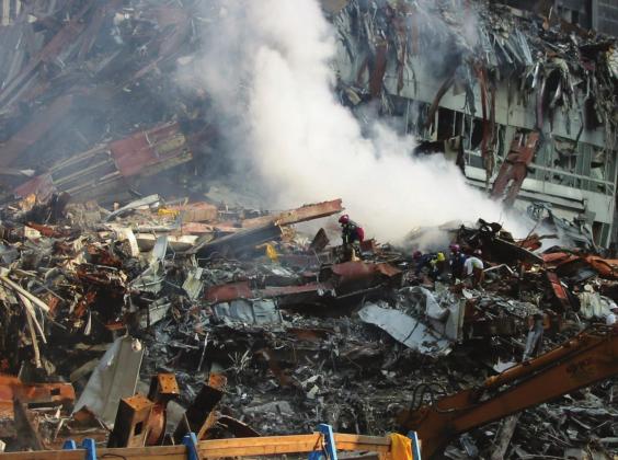 Fires remained burning two weeks post attack; rescuers searched in the rubble, fi rst for survivors, then remains. Courtesy photo.
