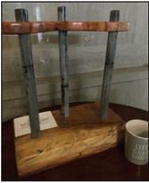 This custom pecan wood rack uses old Menard County jail bars and was crafted by Billy Kniffen to be auctioned at the PTO auction, Nov. 12.