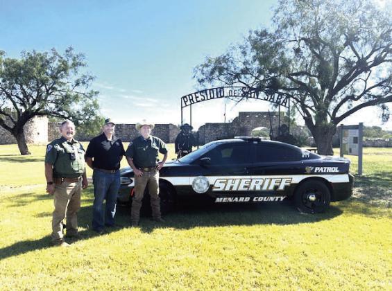 GRANTING DREAMS- Menard County Sheriff’s Deputy Coy Morales, MC Judge Brandon Corbin, and MC Sheriff Burl Hagler show off the department’s newest patrol vehicle, a 2023 Dodge Charger, acquiesced through grant funding. Morales is well known (locally and for those passing through) for the ticket writing revenue he brings to the county, as well as safer streets and highways. Courtesy Photo.