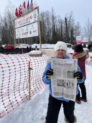 Menard's Dora Wright was in Alaska recently for the ceremonial start of the 52nd running of the Iditarod Sled Dog Race. She packed all of the essentials- gloves, longjohns, a copy of The Menard News... Wright began her interest in sled dogs and racing with an Alaskan mushing trip of her own last year. Courtesy photo.
