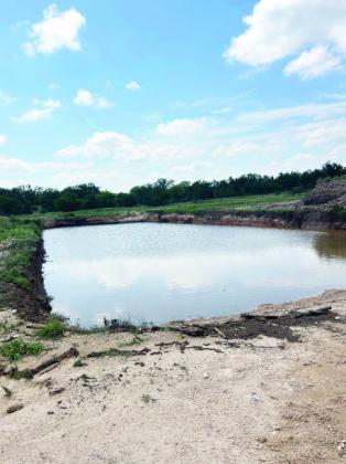 DO NOT BE FOOLED! This is not a refreshing rural watering hole, but instead the city dump pit full of rainwater. With a liquid capacity of 788k gallons, the pit took more than two weeks to pump dry in preparation for this weekend's rescheduled Citywide Cleanup. Photo courtesy City of Menard.