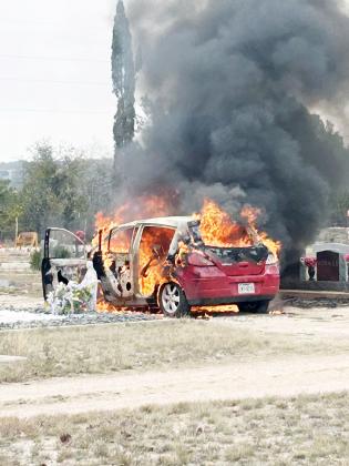 BELOW-Menard Volunteer Fire Department responded to a vehicle fire early Tuesday afternoon. The occupants were passing through Menard when the fire broke out. The driver immediately pulled over and dialed 911. MVFD responded promptly and was able to successfully extinguish the fire. The car was a loss but there were no injuries. Photo by MCSO.