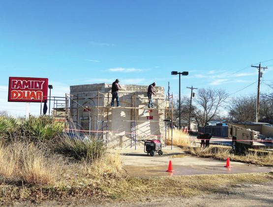 Local masonry crews work to dismantle the abandoned drive-thru ATM structure on the corner of Highway 83 and Travis Street. Menard’s Parent-Teacher Organization (PTO) has purchased the lot. The dismantled rock will be repurposed into a digital sign structure for MISD. TMN photo.