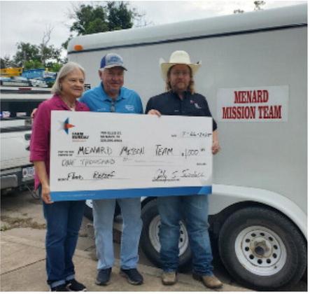 ABOVE- Farm Bureau Board of Directors President Cody Swindall (right) presents the Menard Mission Team representatives Steve Whitson (center) and Charlotte Albrecht a donation check for $1,000 to help with flood disaster property recovery and restoration. Kristin Wilson, Menard County Farm Bureau photo.