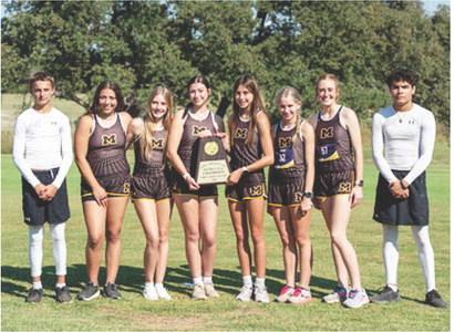 CLEANIN' UP on the course was the Lady Jacket cross country team. Pictured left to right- Yellowjacket Jaegar Leonard; Lady Jacket District Champs: Perla Pecina, Kaitlyn Whitaker, Kendal Lawler, Danni Ruiz, Taytum Chambless, Makenzie Wright; Yellowjacket Floyd Teague. Photo by Nora Davis.