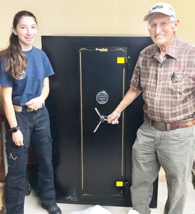 Coach David Hand and senior shooter Mia Estrada show off the new Menard Rifles gun safe. The much-needed vault was made possible by Gary Roberson, whose popular Predator Channel hunting show, Carnivore, is sponsored by Hornady Manufacturing Company. Through Gary’s generous efforts the safe was provided at cost. Hornady even took care of shipping. It is this kind of strong community support which makes our Menard youth programs possible. Courtesy photo.