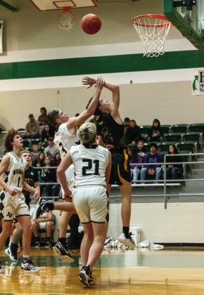 ELI WEATHERLY resists the hand holding offer of a Water Valley Wildcat during Menard's bidistrict loss this week. Nora Davis, photo.