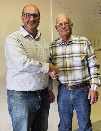 COMBAT CITATION ISSUED- Menard County Judge Brandon Corbin, left, congratulates Navy veteran Jimmy Brooks for his national commendation during Brooks's service aboard the USS Bon Homme Richard in the Vietnam War. Courtesy photo.