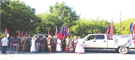 MARCHING THROUGH TIME- Several area Sons of Confederate Veterans camps got together to participate in Bandera’s Labor Day parade. The whole group is pictured above with their prize-winning parade entry. Menard participants include: Buck Bostwick; Eddie Bostwick; Mike McCammon; Gary Bates; Katherine and John Kniffen; Wayne Carlile; Barry Kniffen; Chief Broken Eagle, Ray Hernandez; three SCV members from Medina; Don and Bonnie Taylor. Courtesy photo.