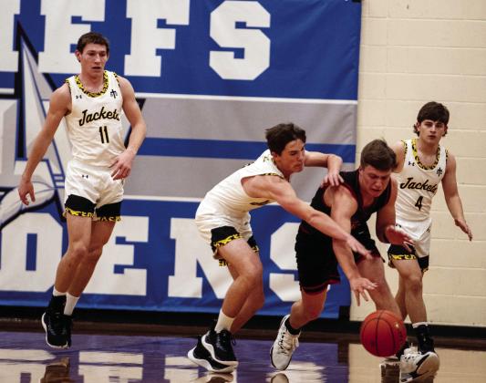THIS PHOTO SUMS UP the Jackets' bi-district loss against Garden City on Monday. The Jackets worked hard but never managed to overtake the Garden City Bearkats, taking the 59-41 loss. Sandy Kothmann, photo.