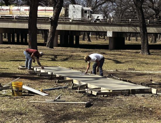 IN THE BEGINNING there is a concrete footer to support the city's permanent outdoor stage at Low Water Park. Construction crews continue to make progress and the facility should be ready to use in June.