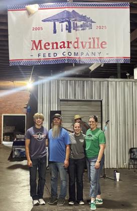 INTRODUCING MENARDVILLE FEED CO., Formerly Compton Warehouse. The Burch family celebrated 20 years of business Saturday, complete with live music, food, door prizes and of course, the unveiling of the store's new name. Pictured is the family behind the last 2 decades, Benjamin, Brandon, Caitlyn and Cristy Burch. See more on page TMN photo.