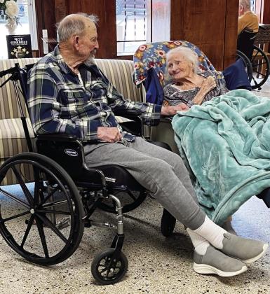 Many will recognize these two former Menard High School classmates and lifelong friends. Carl Kothmann and Litane Landers Kothmann were able to catch up recently during some deep conversation at Menard Manor. Photo courtesy Menard Manor Facebook page.