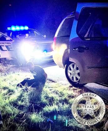 One of 5 high-speed chase-turned-bailout suspects sits upon the side of US HWY 83 in the early morning hours of Sunday, May 15, 2022. Two suspects were arrested immediately by Kimble County agencies, and three more were apprehended by Menard SO near Menard the next day. Photo courtesy KCSO Facebook page.