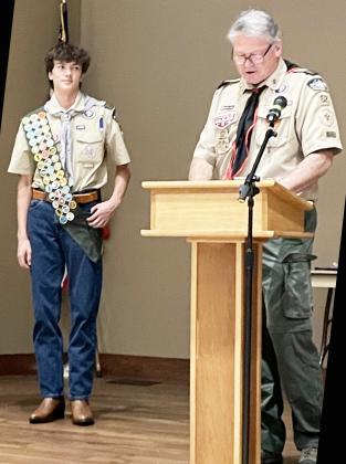 Nicholas Royal, grandson of Bill and Jo Ann Royal of Menard, recently accepted his Eagle Scout pin and sash from a Scout leader. A junior at Lake Travis High School, Nicholas has followed in his grandfather Royal’s footsteps, who is also an Eagle Scout. Courtesy photo.