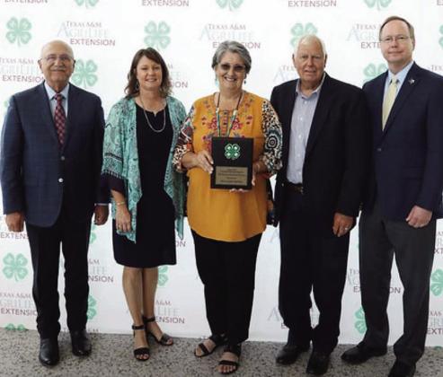 SALUTE TO EXCELLENCE- College Station and Texas A&amp;M was the site of the 2023 Texas State 4-H Roundup last week. While many local 4-H members competed and were recognized, volunteers Mary and Billy Kniffen were awarded the Salute to Excellence Award. Pictured left to right: Dr. Jeffrey W. Savell, Vice Chancellor and Dean of Agriculture &amp; Life Sciences; Lisa Brown, Menard County AgriLife Extension Agent; Mary and Billy Kniffen; Dr. Rick Avery, Director of AgriLife Extension. Courtesy photo.